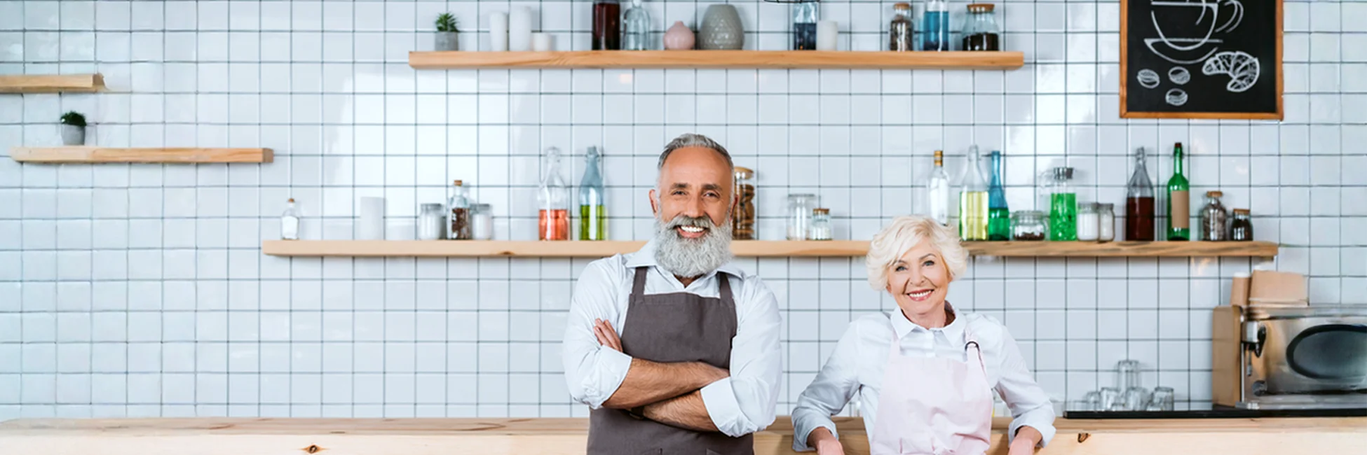 Business owners at their shop—retirement income planning after a company sale